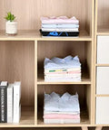 Slick Setup Folding Clothes Organizer Set For Quick T Shirt Folder Board With Stackable Clothing Dividers in a wooden shelf, neatly folded shirts.