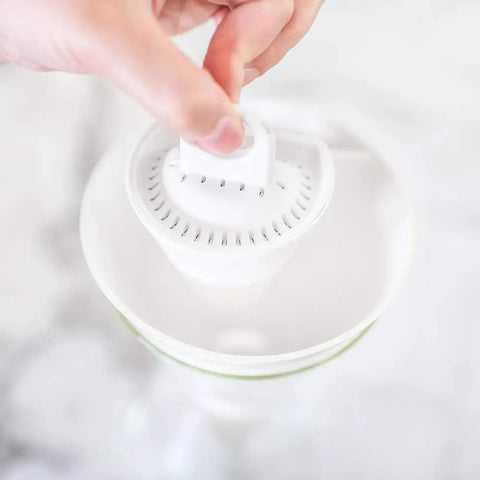 Inserting Plant Based Replacement Water Pitcher Filter Pack Of 2 With Coconut Shell Activated Carbon for cleaner water.