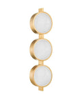 Modern Three Light Wall Sconce Sporting Vintage Brass Finish And Seeded Glass Shade Damp Rated For Bathrooms, 3 circular seeded glass shades.