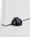 No Fuss Floor Door Stops Adhesive Backed Stainless Steel Black Wall Protectors Rubber Bumper No Drill Setup Heavy Duty Door Blockers in use.