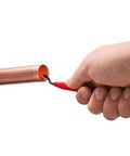Hand using Reaming Pen Pro Grade Tool For Precision Hole Finishing on copper pipe, showing durable aluminum body and ergonomic grip.