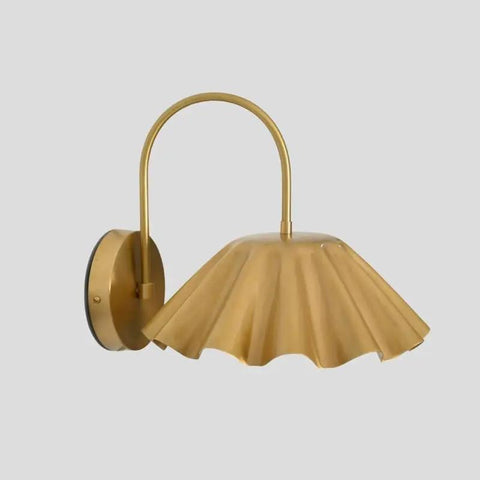 SHAHLUMES Handcrafted Curved Brass Flower Wall Sconce | Modern Bedside Wall Light with fluted shade in brass finish.