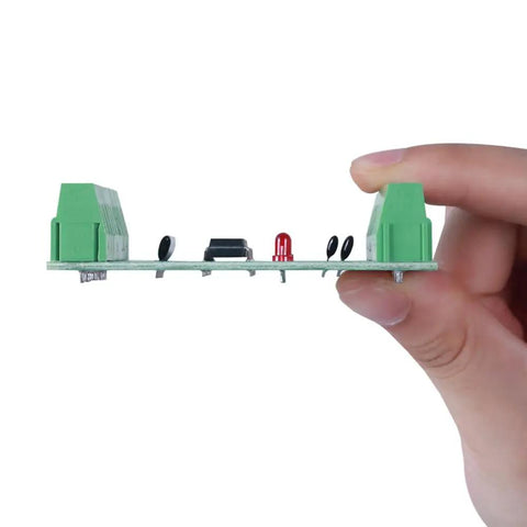 Side view of Eight Channel Optocoupler Isolation Module For 3.3V And 5V DC Signals PNP NPN Output in hand showcasing connectors