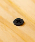 Heavy Duty No Sweat Number 6 By 1 Inch Drywall And Wood Screws Featuring Coarse Threading And Flat Truss Head resting on wood.