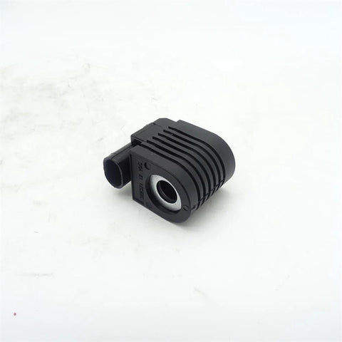 Solenoid valve coil for loader skid-steer; angled front view, black ribbed housing with electrical connector