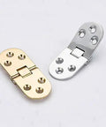 Brass flush mounted folding furniture hinge with self locking design for cabinets doors tables and closets, shown with silver variant