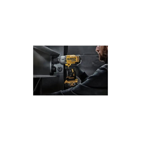 User operating Cordless 20V Max XR Half Inch High Torque Impact Wrench Kit on metal surface