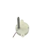 Front view of a white plastic DC gear motor with vertical metal shaft and red/black wires.