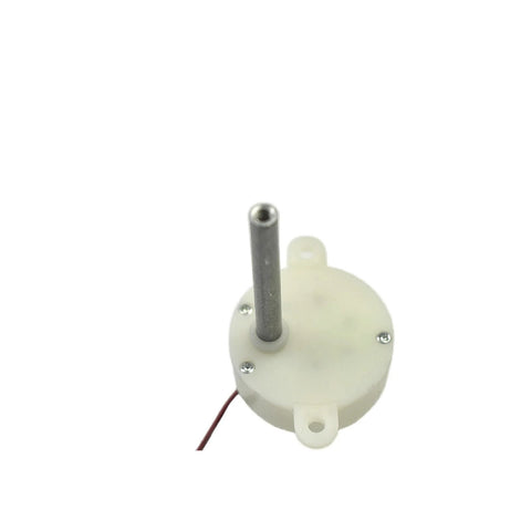 Front view of a white plastic DC gear motor with vertical metal shaft and red/black wires.