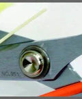 Six And A Quarter Inch Carbon Steel Shears cutting Kevlar and fiberglass, close-up on chrome pivot and black handle.