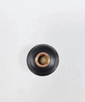 View of a high performance starter caliper for SL60 and SL100 plasma cutting torch consumables, featuring black rubber and copper components.