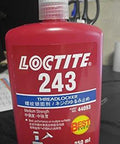 Red bottle of Loctite 243 medium-strength threadlocker with product information, 250 mL, on a table.