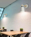 EDFGVH Single Heads Iron Art Lamp Body Wall Lamps with E26/E27 Metal Base Sconces 10.6in installed on a brick wall in a dining area.