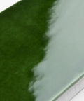 Close-up of Viva Antic Verde 3x6 Ceramic Wall Tile with dope glazed high sheen finish and subtle tone variation