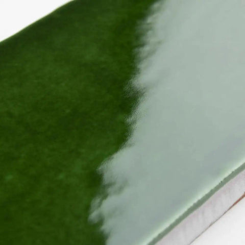 Close-up of Viva Antic Verde 3x6 Ceramic Wall Tile with dope glazed high sheen finish and subtle tone variation