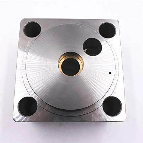 Waterjet end bell assembly front view; metal block with brass center bore and four mounting holes.