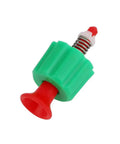 Close-up of a pressure relief valve for garden backpack sprayer; green plastic body, red nozzle, and metal spring.