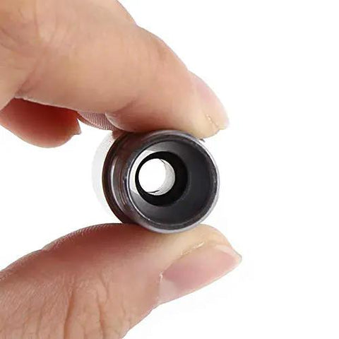 Close-up of 5mm CNC Metal Mill Spindle Collet Holder With Straight Shank And Clamping Nut Balanced Steel Design held between fingers.