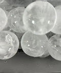 Countertop Ice Maker Machine Portable Sphere Creator Unit With Auto Self Cleaning And Responsive Touch Panel For Fast No Sweat Daily Batch Production At Home Bars And Weekend Sessions Party Ready Style - close-up of spherical ice cubes.