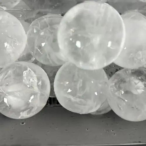 Countertop Ice Maker Machine Portable Sphere Creator Unit With Auto Self Cleaning And Responsive Touch Panel For Fast No Sweat Daily Batch Production At Home Bars And Weekend Sessions Party Ready Style - close-up of spherical ice cubes.