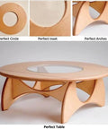 Wooden table with circular glass inset and arch design, highlighting perfect circle cut achieved with Circle Cutter Jig For Routers.