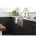 Modern kitchen with Champagne Bronze Cabinet Hardware Set 5 Pack Adjustable Drawer Pulls on dark cabinets near farmhouse sink.