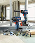 Bosch blue cordless drill and impact driver on a metal-framed construction site with drill bits