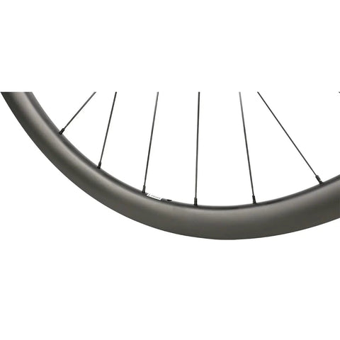 Close-up of the Carbon Fiber 38mm 700c Disc Brake Road Bike Wheelset Clincher Tubeless Ready with MT075 Hub 24 Hole Spokes