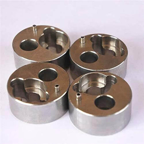 Top view of four 7/8-inch metal poppet housing components for waterjet pump accessories.