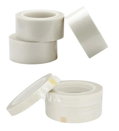 Stacked rolls of Double Sided PTFE Tape White Teflon Film With Adhesive On Both Sides, 0.2mm thick, 35mm wide, 20m long.