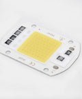 LED COB Chip Floodlight Bulb 20W 30W 50W 220V Input High close-up view of COB chip on white board.