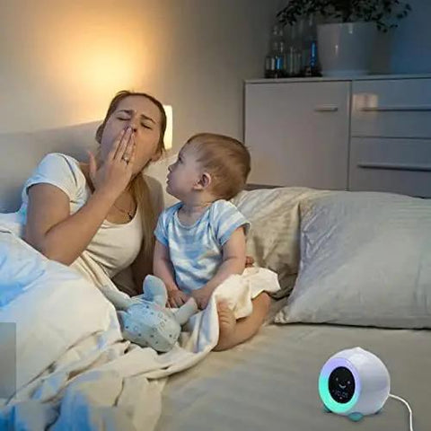 Mother and child in bedroom with Power Cord For Hippo Clock Night Light And Sleep Sounds Machine, 5ft Barrel Style White AC Adapter Charger visible