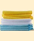 Amazon Basics microfiber cleaning cloths, blue, white and yellow, stacked six-pack.