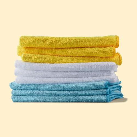 Amazon Basics microfiber cleaning cloths, blue, white and yellow, stacked six-pack.
