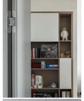 Straight Up Heavy Duty Concealed Door Hinges, 180 Degree Adjustable Hardware For Smooth Silent Invisible Folding And Hidden Secret Rooms, Black Finish Stays Flush When Closed attached to a modern bookshelf.