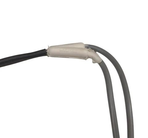Close-up of Durable Silicone Drain Heater With Metal Braided Cable For Ice Proof Drains in Kitchen and Bath, showing connections.