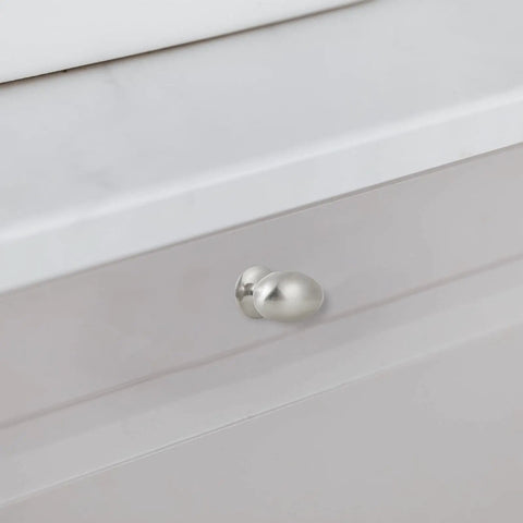 Smooth And Stylish Satin Nickel Mushroom Cabinet Knobs For No Sweat Hardware Swaps And Instant Kitchen Glow Ups That Fit Perfectly On Drawers Cupboards And Desk Surfaces on a white drawer.