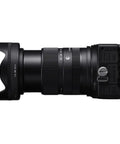 Side view of 18-50mm F2.8 DC DN Contemporary Lens for Canon RF Mount Mirrorless Cameras, showing zoom ring and controls.