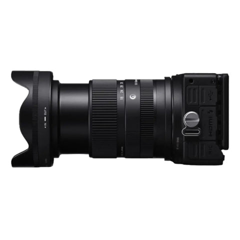 Side view of 18-50mm F2.8 DC DN Contemporary Lens for Canon RF Mount Mirrorless Cameras, showing zoom ring and controls.