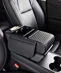 Waterproof Faux Leather Armrest Box Mat With Dual Cup Holders, Phone Slot, Tissues, Side Pockets, Elastic Straps, And Absorbent Cup Coaster, Quilted Elbow Rest For Long Drives, Keeps Your Ride Clean, Organized, And Comfy. black car armrest mat with dual cup holders and side pocket