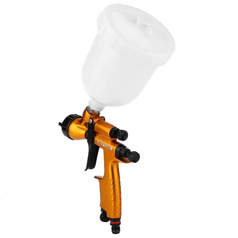Heavy-Duty 1.3mm Gravity Paint Sprayer With High Atomization Pneumatic Airbrush in orange with white cup for fine finishes.