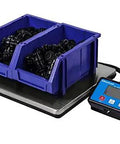 Heavy Duty Parcel And Shipping Scale With 330 Pound Capacity Clear LCD Display Stainless Steel Platform AC Adapter Included Or Four AA Batteries A Real Workhorse For Warehouse And Industrial Shipping showing blue backlit indicator and steel platform with blue bins of hardware