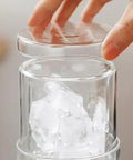 Close-up of Portable Cold Brew Coffee Maker With Slow Drip Tower and Adjustable Flow Control showing ice cubes in borosilicate glass.