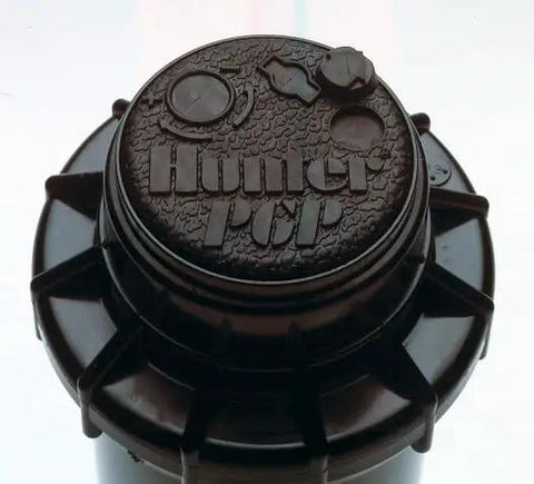 Tough As Nails Gear Drive Pop Up Lawn Sprinkler Boasting Preinstalled Number 6 Nozzle For Rock Solid Four Inch Lift And Straight Running Thirty Four To Thirty Eight Foot Reach, top view showing detailed nozzle design.