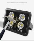 Tough As Nails Outdoor Floodlight With Knockout Led Projection And IP66 Waterproof Body That Drives Off The Dark Like A Boss Plus Rechargeable Work Light For Roofs Or Patios Cuts Power Costs Swiftly. Hammer striking LED floodlight to show durability.
