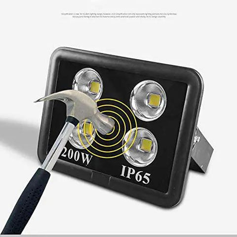 Tough As Nails Outdoor Floodlight With Knockout Led Projection And IP66 Waterproof Body That Drives Off The Dark Like A Boss Plus Rechargeable Work Light For Roofs Or Patios Cuts Power Costs Swiftly. Hammer striking LED floodlight to show durability.