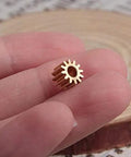 Two Pack Brass Spur Gears, 0.5 Modulus, 12 Teeth, 3mm Bore, 5mm Gear Width held between fingers