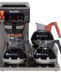 Automatic Commercial Coffee Brewer With 3 Lower Warmers 120V Delivers 3.9 Gallons Per Hour Hot Water Tap And Backup Pour Over SplashGard Deflector Stainless Steel Construction Compatible With Carafes Decanters And Airpots with three BUNN carafes on warmers.