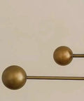 Brass Chandelier Light Fixture, Handmade Sputnik Style Modern Ceiling Light close-up of raw brass accents and spherical shapes.