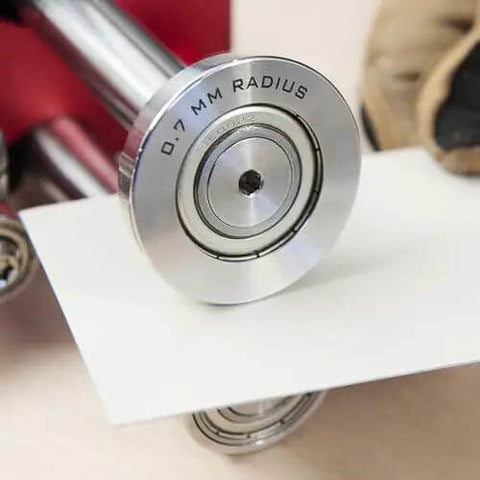 Close-up of Two Station Metal Bender Pro Grade for precise bends under 150mm, adjustable roller spacing from 0.5mm to 1mm.